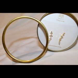 Dangly diamond and gold earrings.